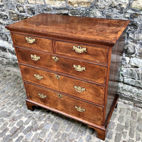 A George II Walnut Chest Of Drawers