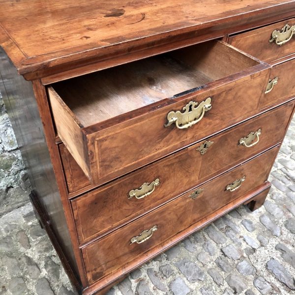 A George II Walnut Chest Of Drawers