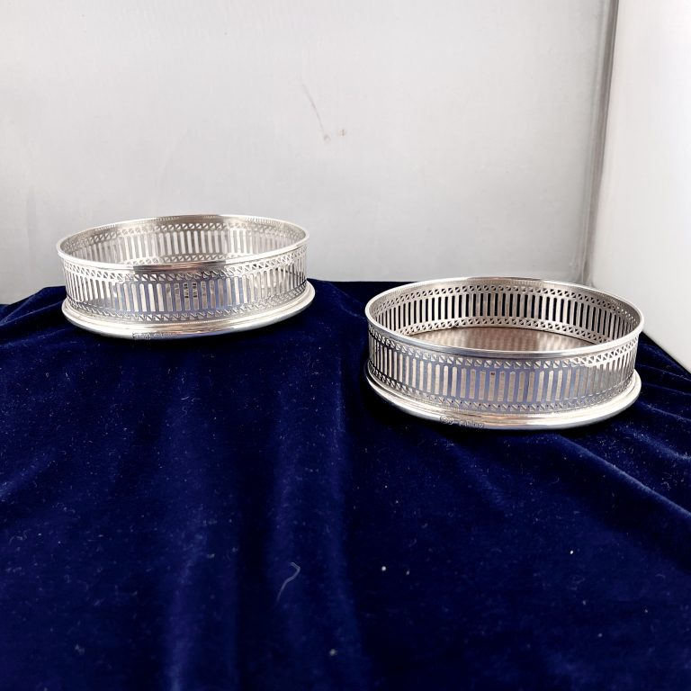 A Pair of Pierced Silver Wine Coasters